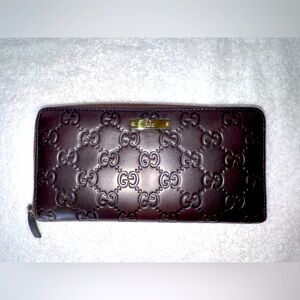 Gucci Guccisima dark brown leather long zippy wallet.